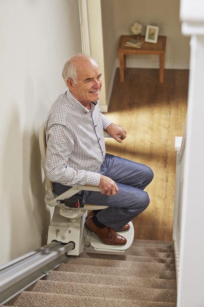 Senior man using a stairlift
