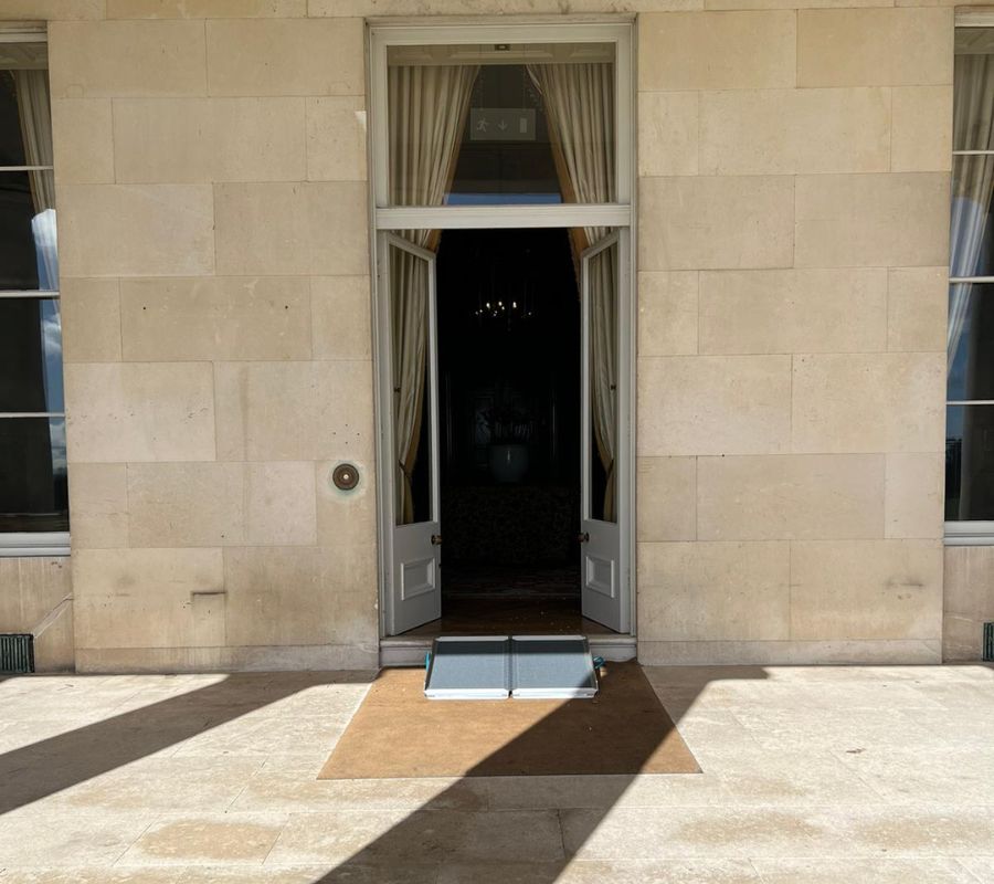 A ramp being used to access a large doorway in Goodwood House